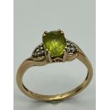 QVC 9 carat GOLD and PERIDOT RING. Full UK hallmark.Complete with ring box.1.6 grams. Size J - J 1/