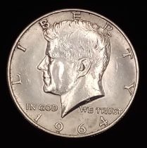 A 1964 Kennedy Half Silver Dollar. Good definition.