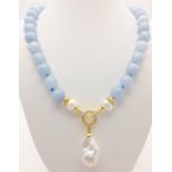 A Blue Aquamarine Beaded Necklace with a Hanging Keisha Baroque Pearl Pendant. Gilded clasp. White