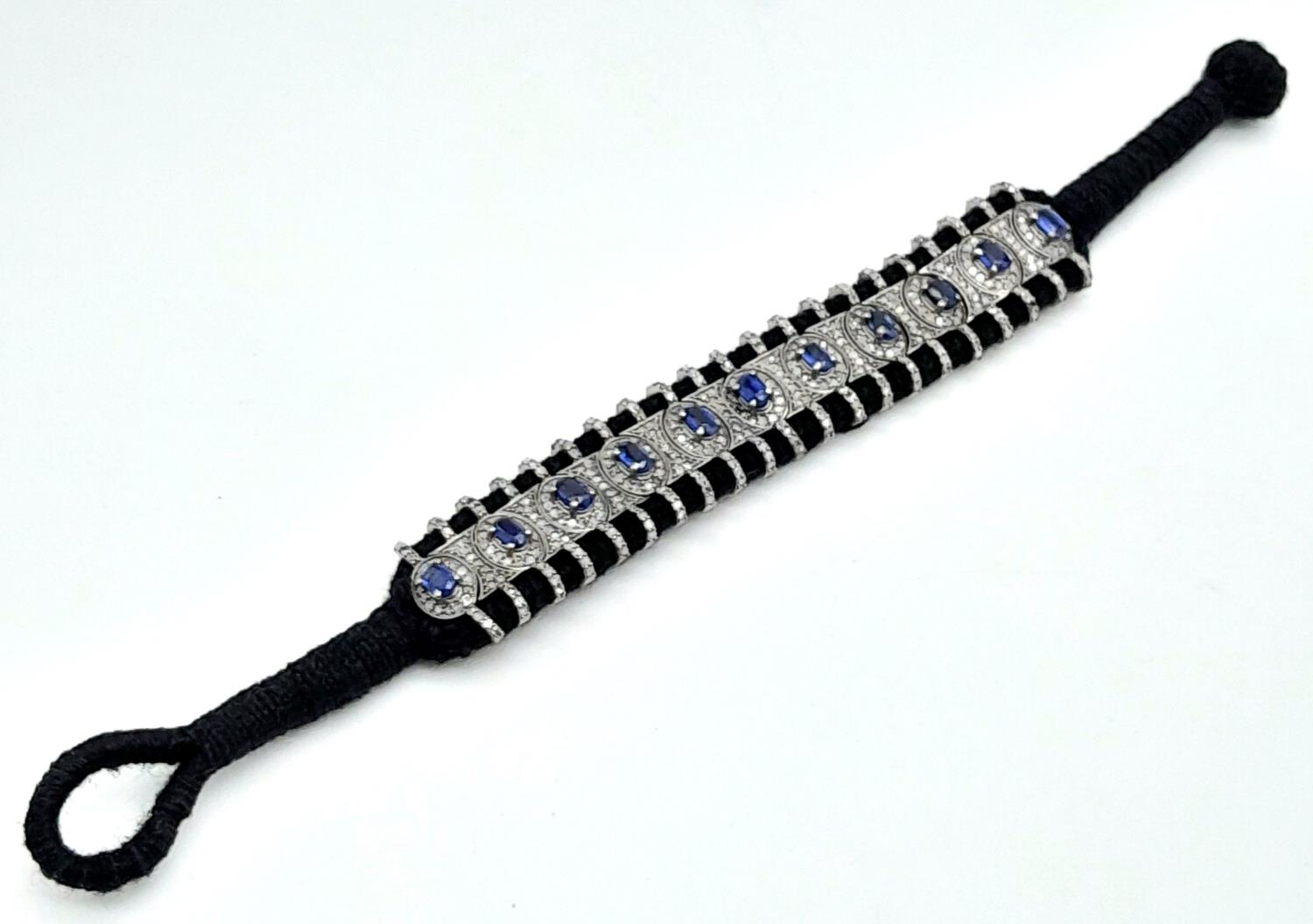 A Hand-Crafted Blue Sapphire and Diamond Encrusted Bracelet. Black textile set. Sapphires - 5ctw. - Image 2 of 8