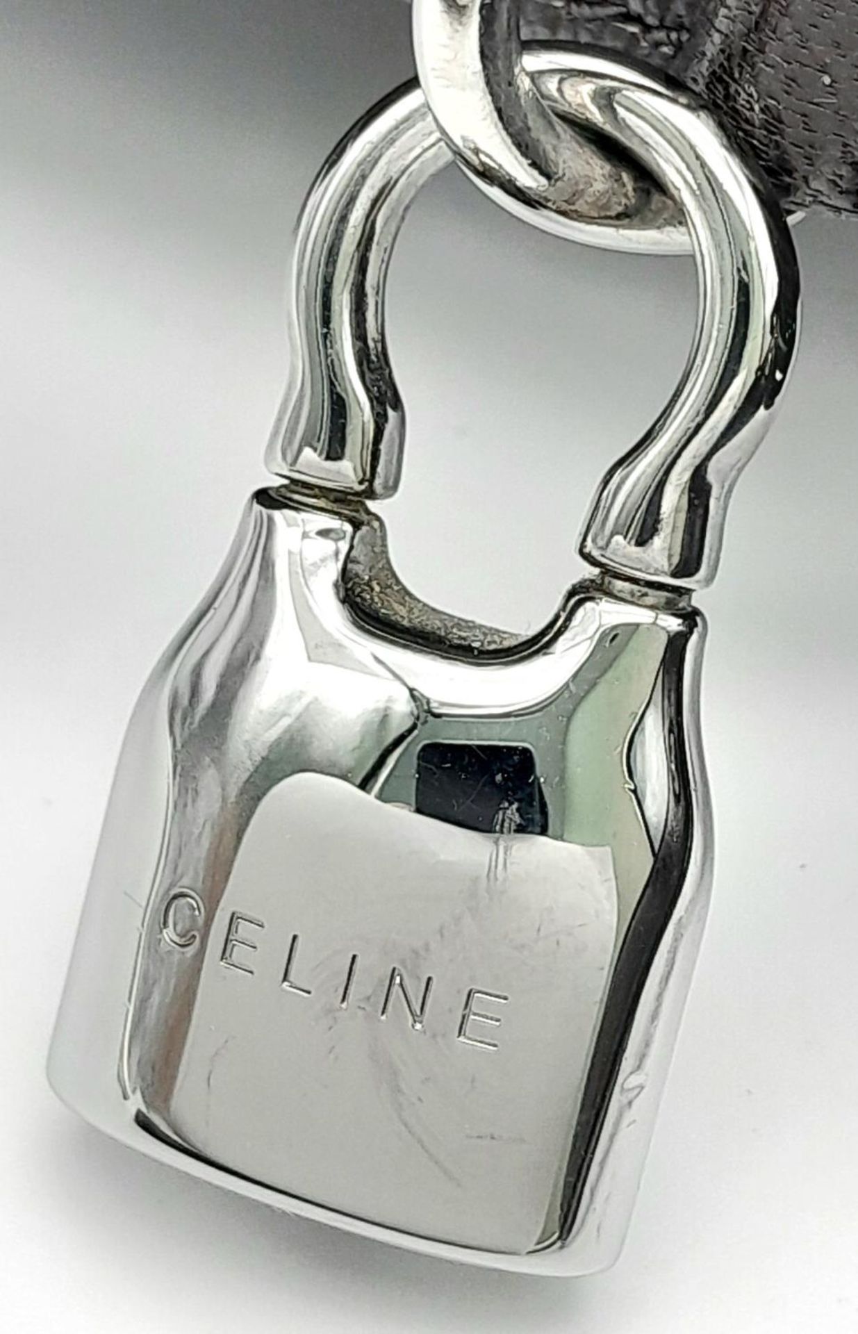 A Celine Dark Brown Shoulder Bag. Leather exterior with silver-toned hardware, single strap, press - Image 9 of 10