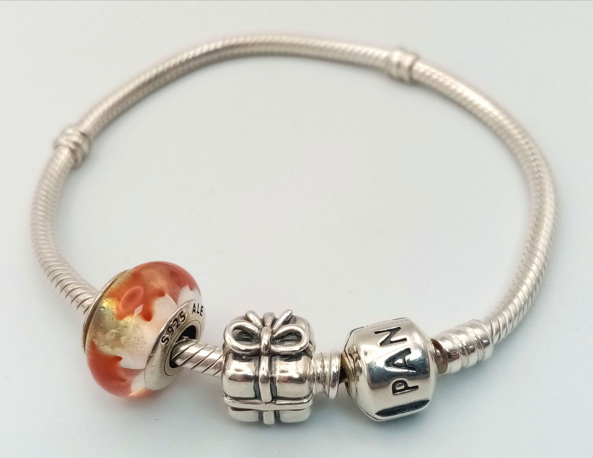 A Pandora Silver Charm Bracelet with Two Charms. 22g