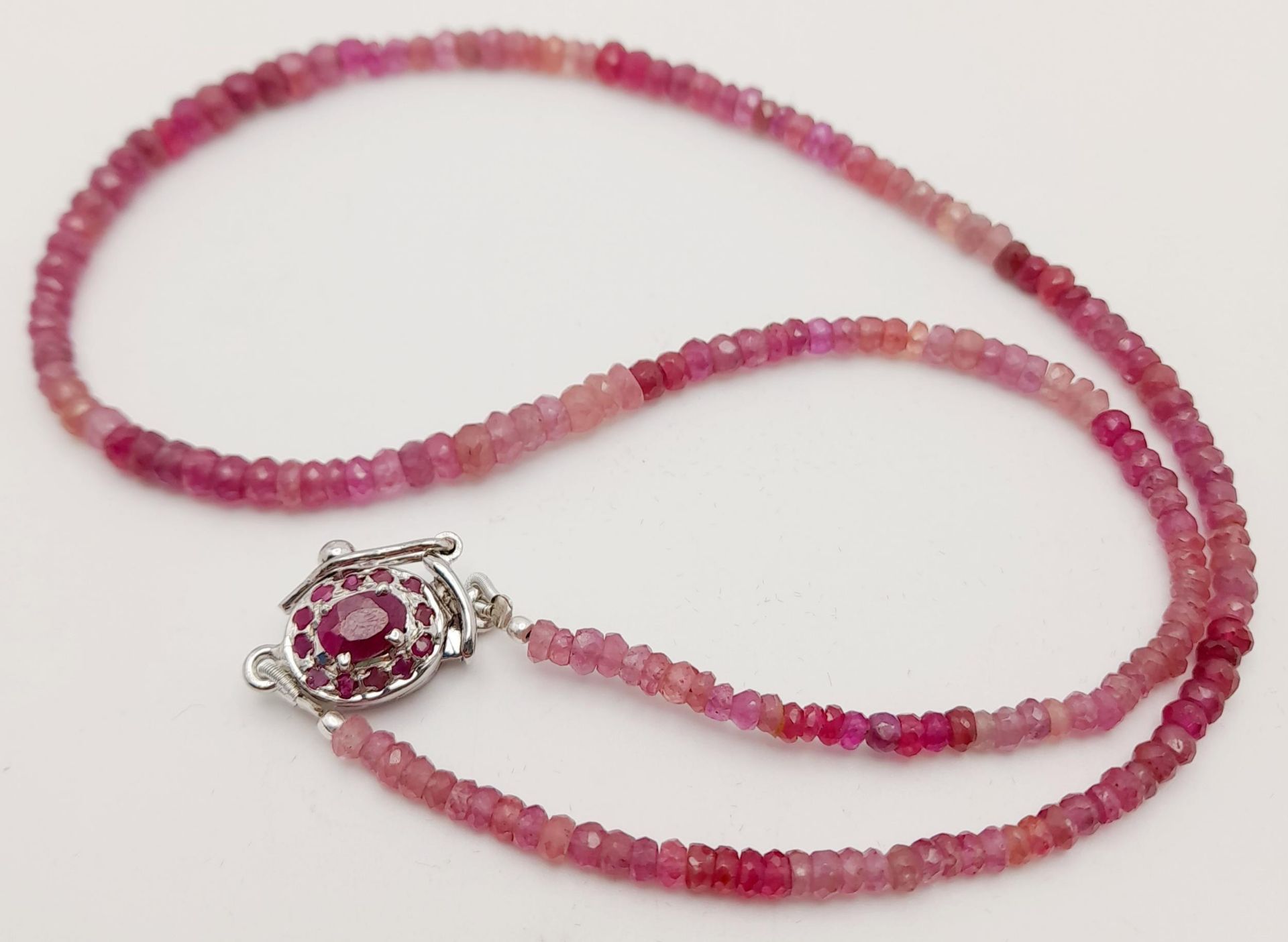 A 90ctw Ruby Rondelle Gemstone Single strand Necklace -with a Ruby and 925 Silver clasp. 44cm