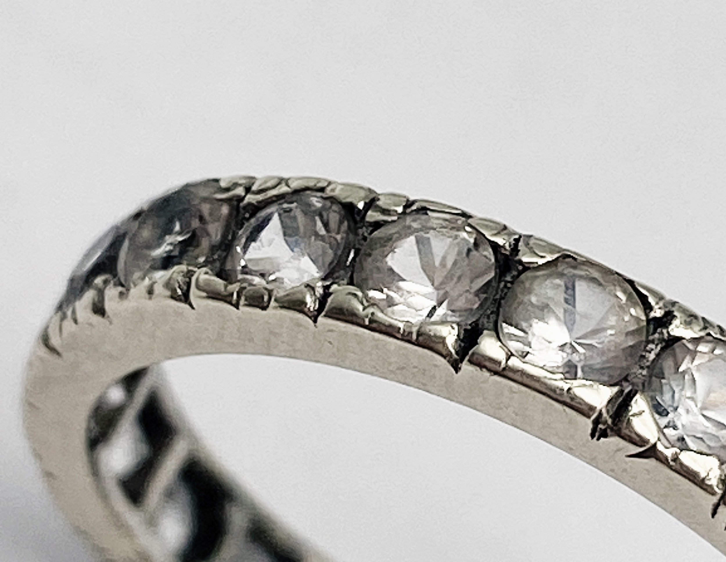 A VINTAGE 9K WHITE GOLD (TESTED) WHITE STONE FULL ETERNITY RING. 2.5G. SIZE 0. - Image 5 of 6