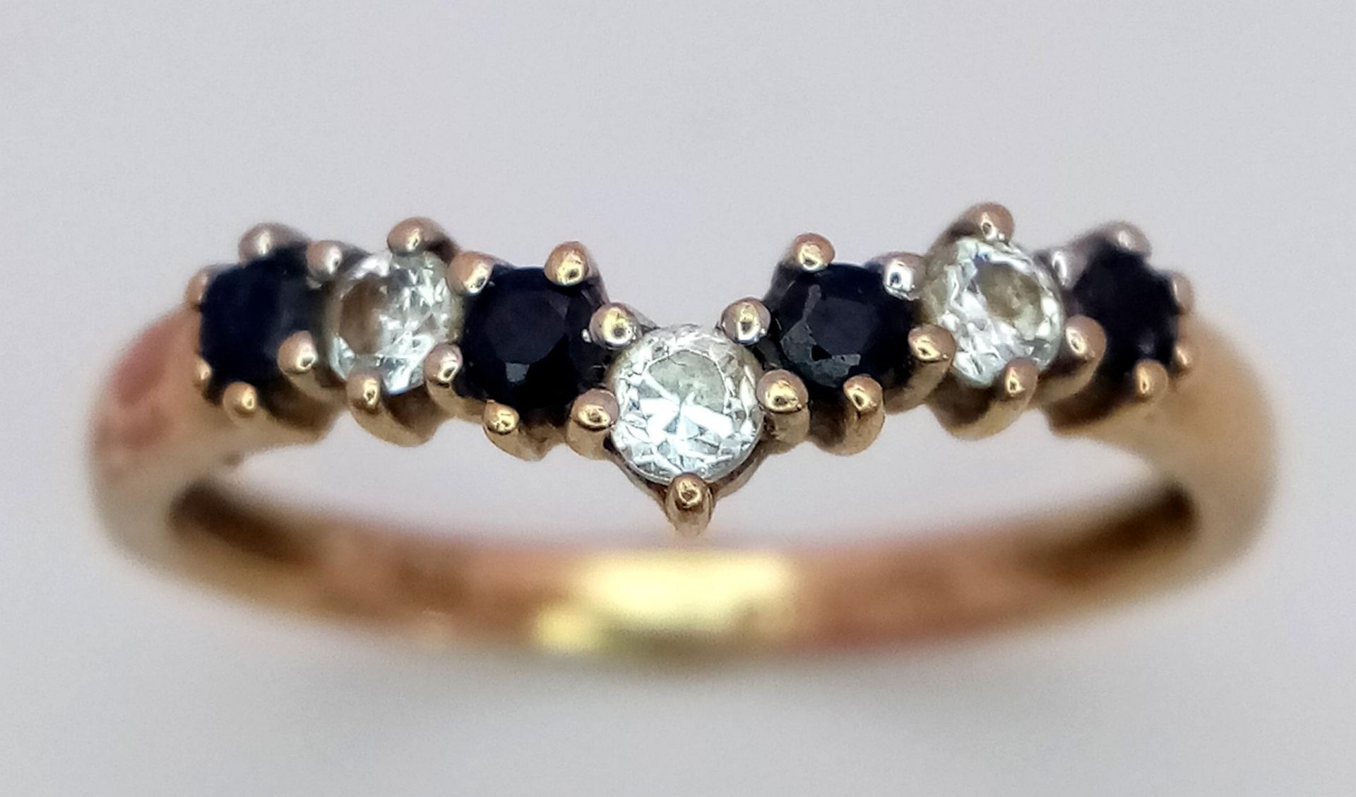 A 9K Yellow Gold Sapphire and White Zircon Chevron Ring. Size M. 1.5g total weight. - Image 2 of 6