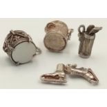 A SELECTION OF 4 X STERLING SILVER CHARMS - DUSTBIN, ICE SKATES, GOLF BAG WITH CLUBS, AND DRUM. 9g
