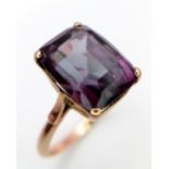 An Intriguing 9K Rose Gold Blue/Purple Gemstone Colour Change Ring. Size O. 4.1g total weight.