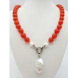 A Deep Orange Cat's Eye Beaded Necklace with a Hanging Keisha Baroque Pearl Pendant. 12mm beads.