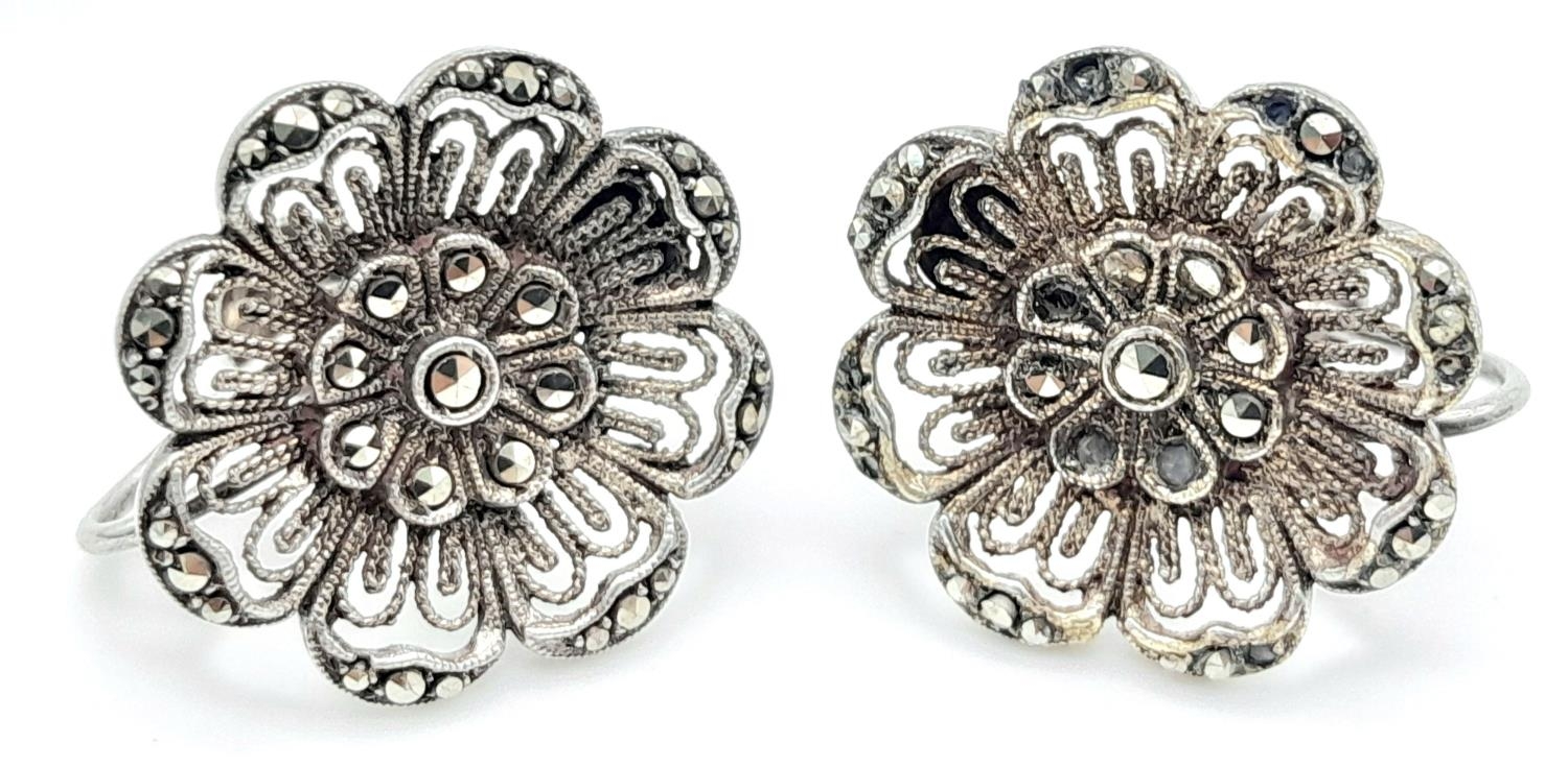 A Pair of Silver Filigree Marcasite Screw Clip Earrings. 19mm diameter, 6g total weight.