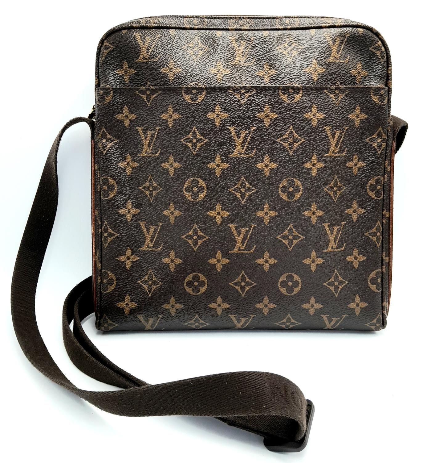 A Louis Vuitton Trotteur Beaubourg Satchel Bag. Monogramed canvas exterior with gold-toned hardware,