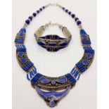 A tribal, wonderfully crafted, white metal and lapis lazuli necklace and bracelet set in a