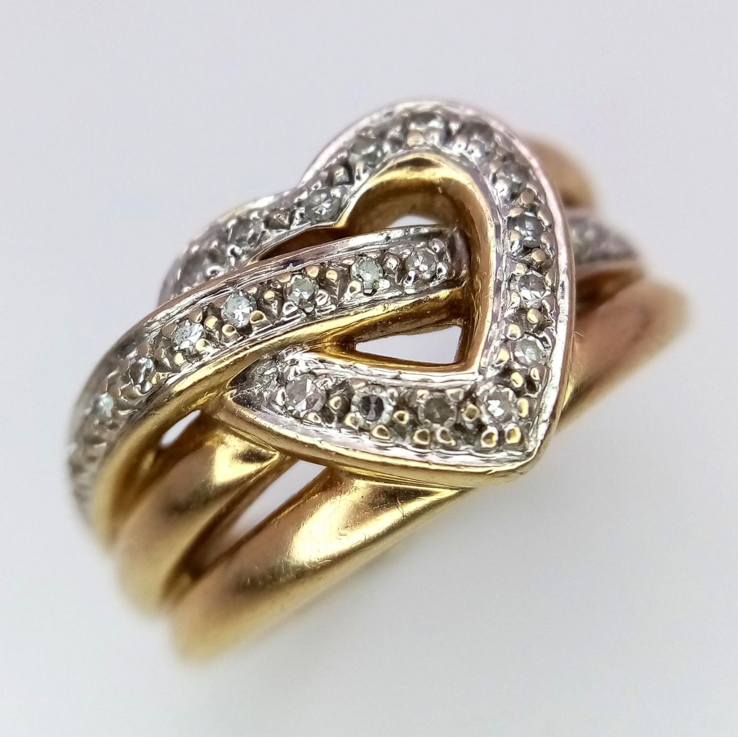 A 9K YELLOW GOLD DIAMOND SET HEART RING 5.6G SIZE M 1/2. SC 9096