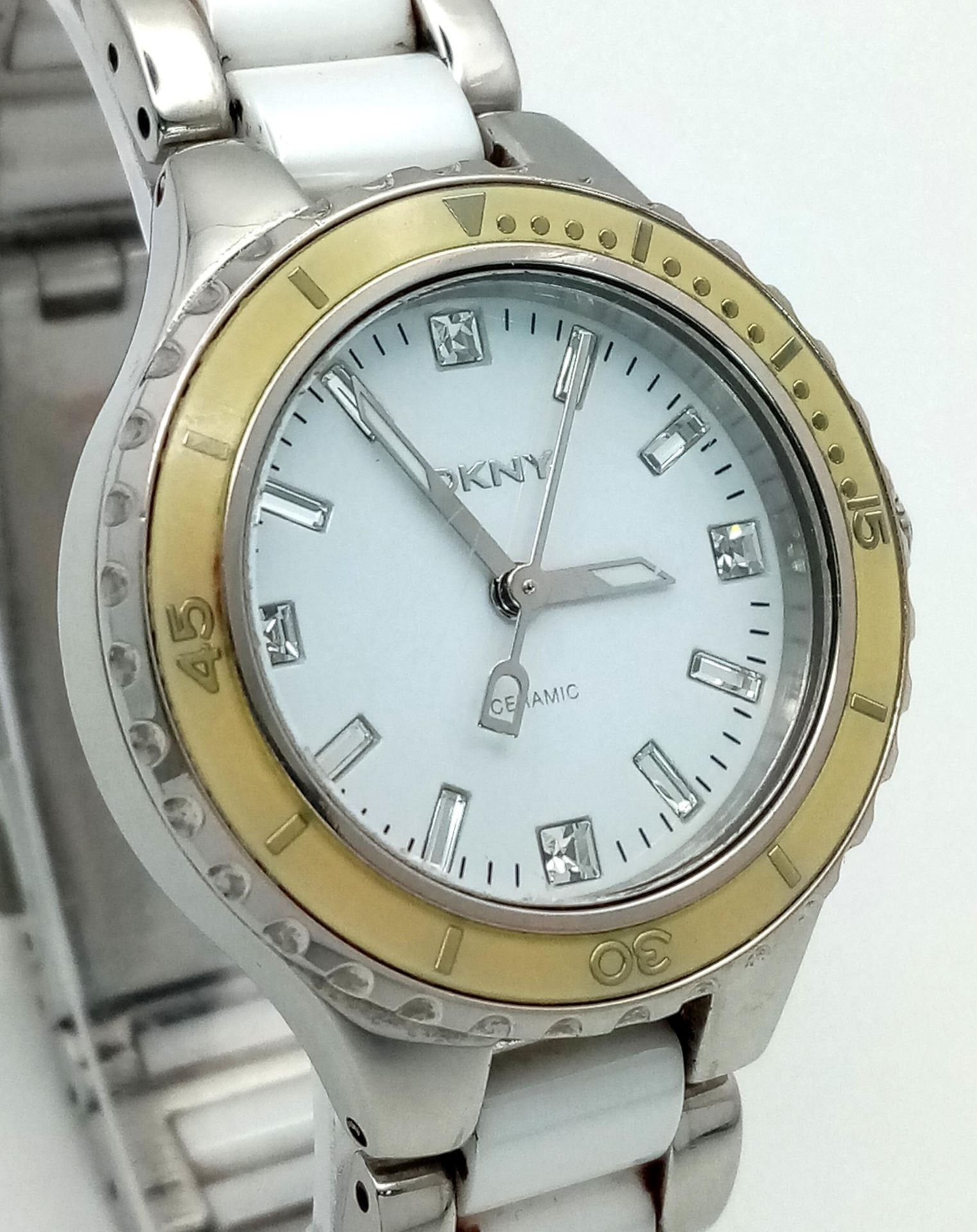 A Ladies Ceramic Bracelet Quartz Date Watch by DKYN (Donna Karen New York). 35mm Including Crown. - Image 3 of 7