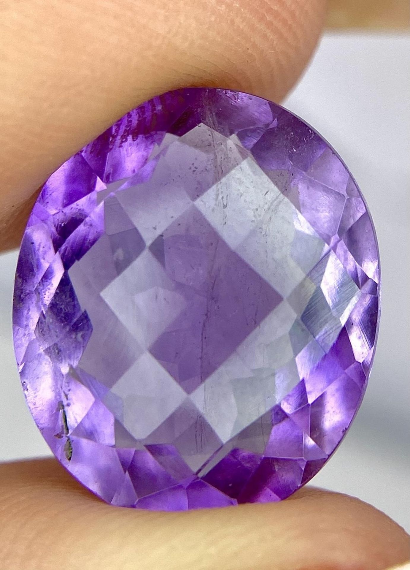 An 11.60ct Oval Faceted Amethyst - IDT Certified. - Image 4 of 5