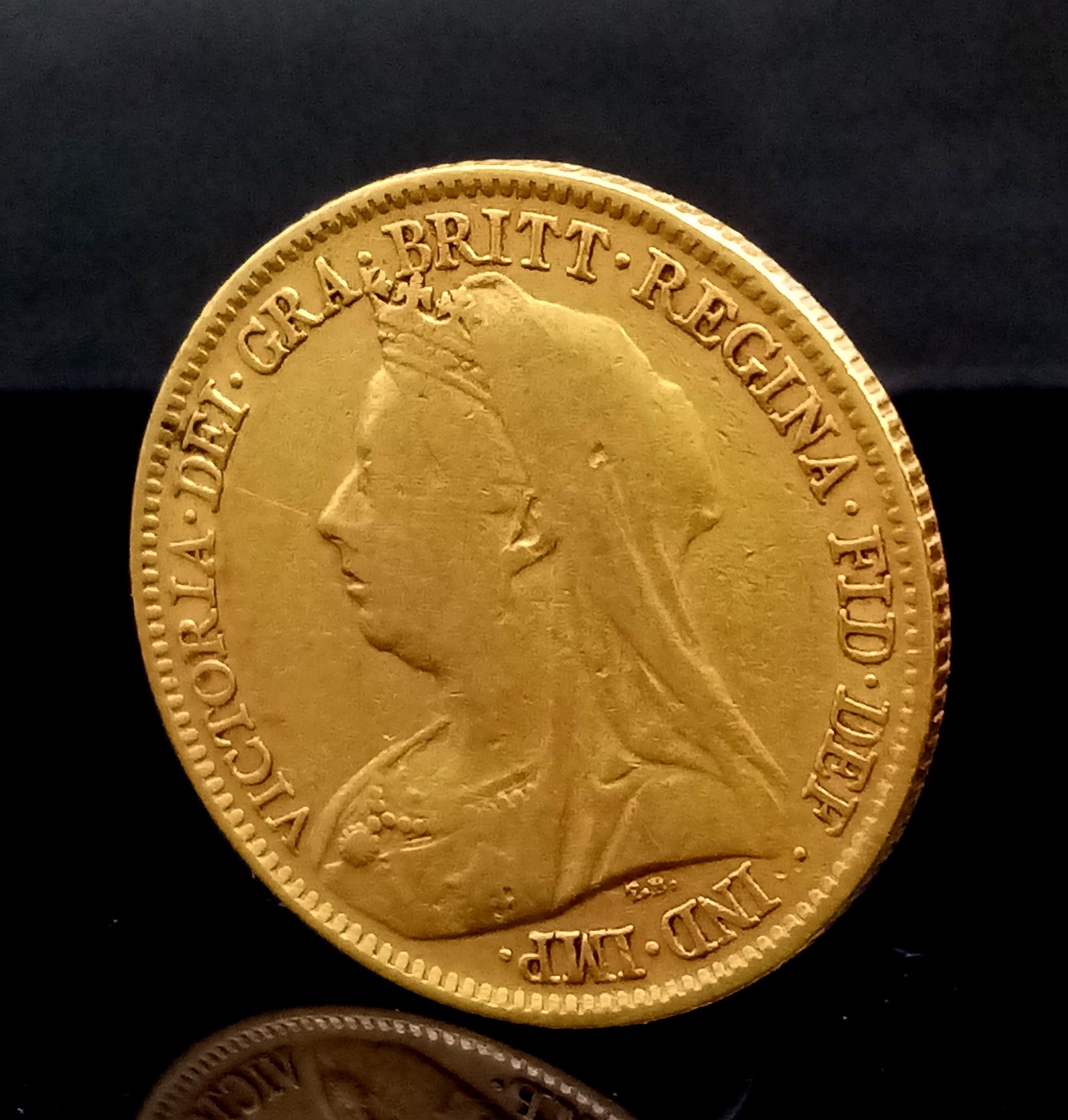 An 1897 Queen Victoria 22K Gold Half Sovereign Coin.