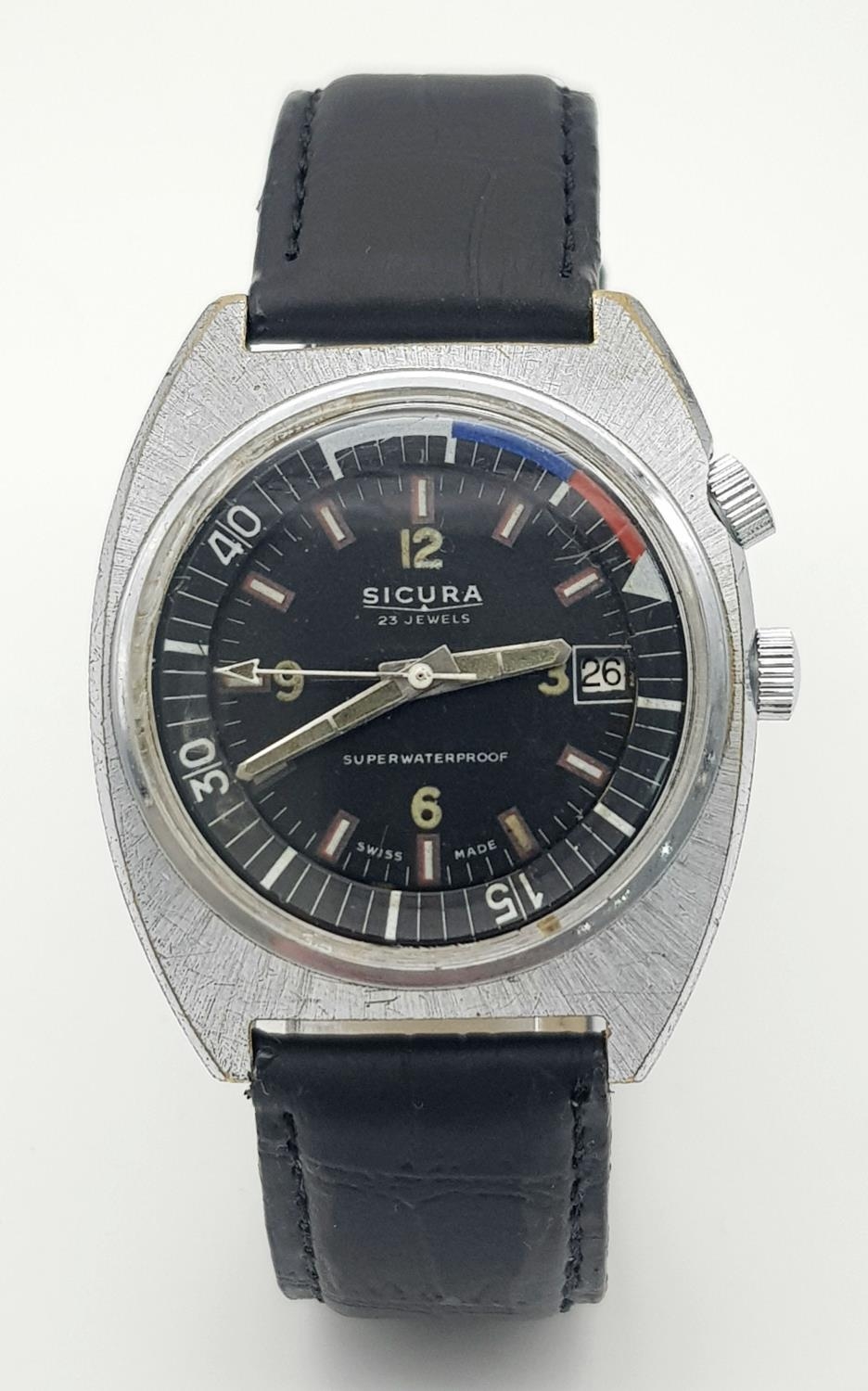 A Vintage Secura 23 Jewels Mechanical Gents Watch. Black leather strap. Stainless steel case - 38mm.