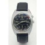 A Vintage Secura 23 Jewels Mechanical Gents Watch. Black leather strap. Stainless steel case - 38mm.