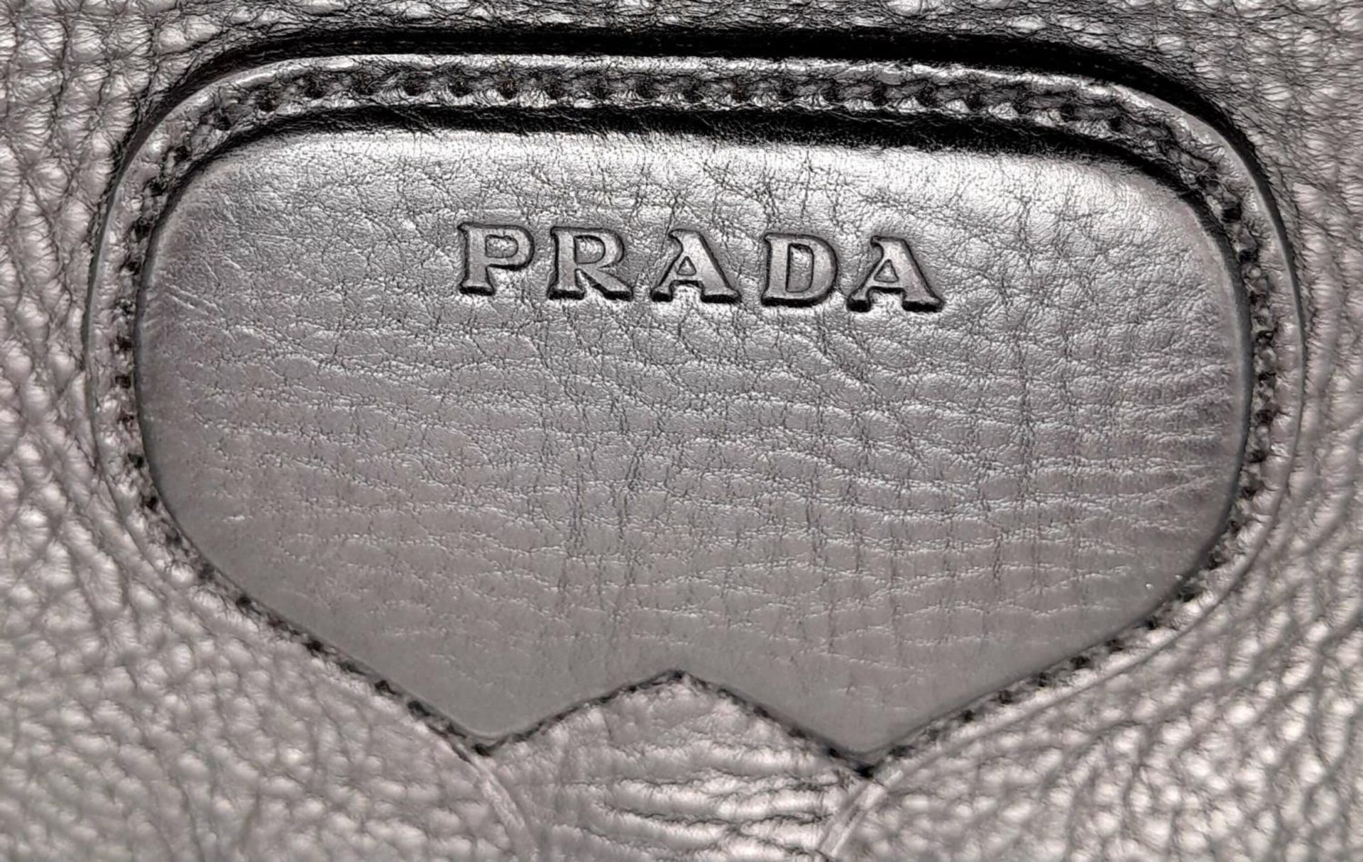 A Prada Black Leather Crossbody Satchel Bag. Textured exterior with buckled flap. Spacious leather - Image 13 of 14