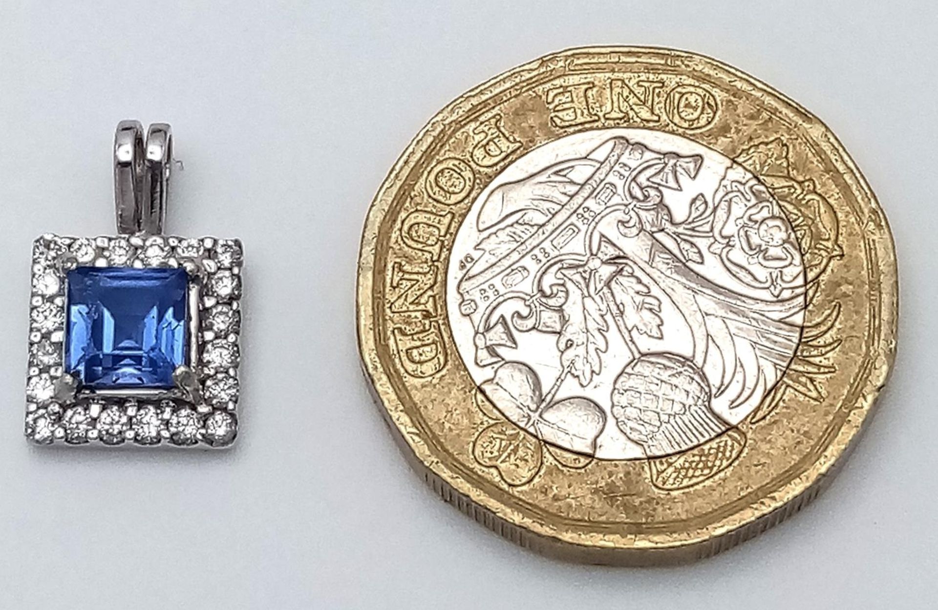 A 18K (TESTED AS) WHITE GOLD DIAMOND & SAPPHIRE PENDANT 1.02CT SAPPHIRE 1.6G. 14mm x 9mm. BL 9003 - Image 3 of 3