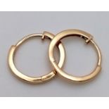 A Pair of Designer Massika 14K Yellow Gold Small Hoop Earrings. 0.8g total weight.