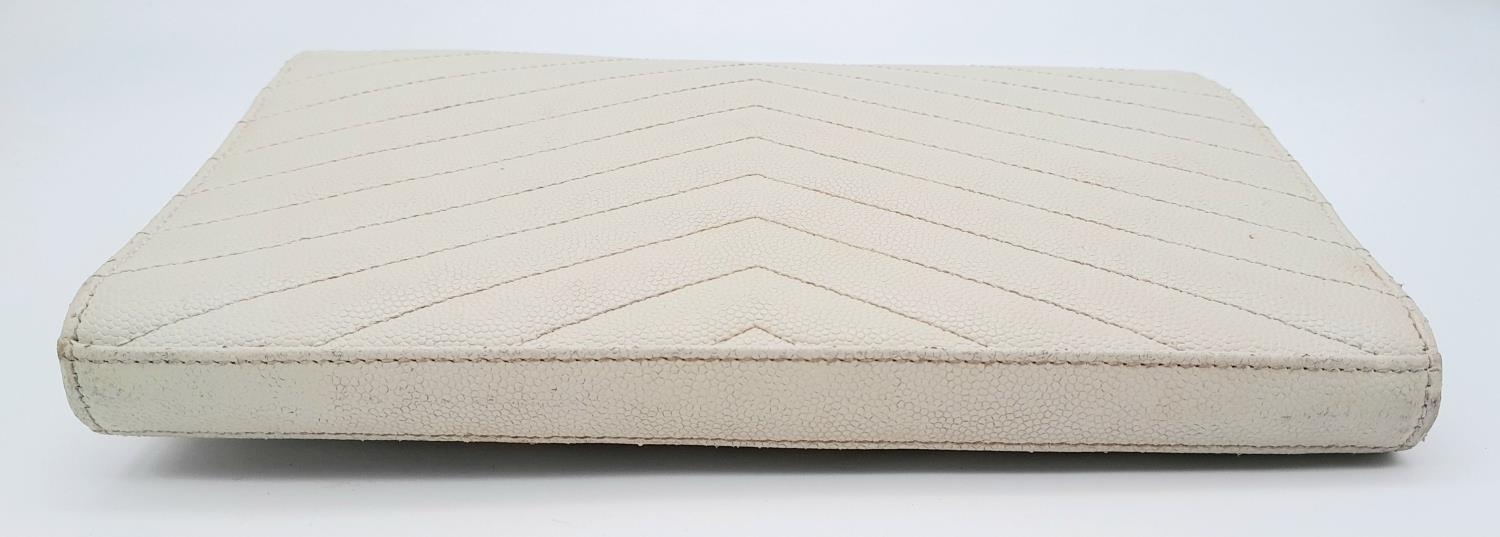 A YSL Ivory Cassandre Wallet Bag. Leather exterior with gold-toned hardware, the iconic YSL logo, - Image 3 of 13