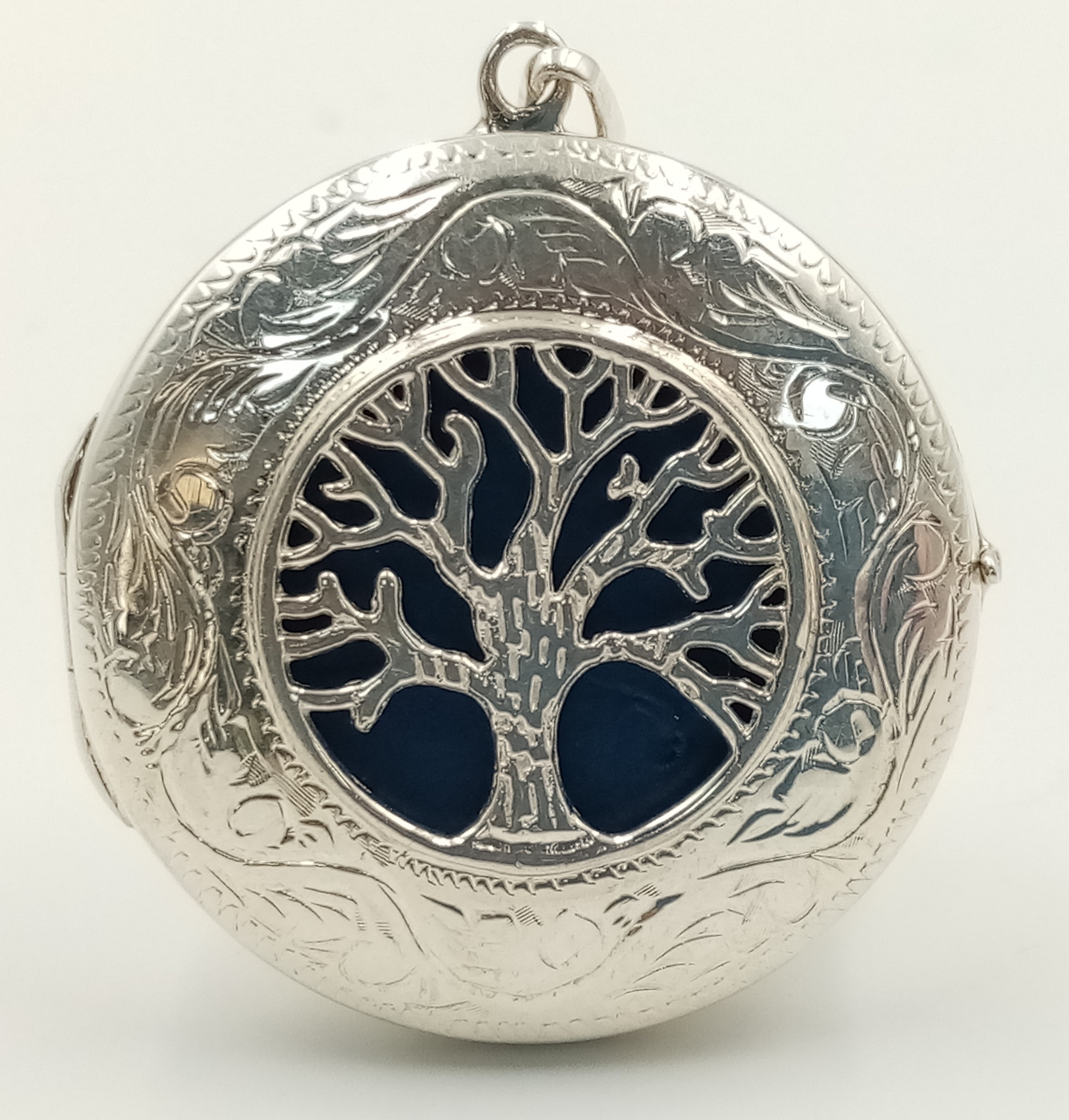 A STERLING SILVER TREE OF LIFE LOCKET. 4.4cm length, 10.6g total weight. Ref: SC 8092