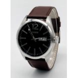A Large Cased Guess Designer Watch. Brown leather strap. Stainless steel case - 46mm. Black dial