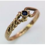 A 9K Yellow Gold and Sapphire Love Ring. Size J. 1.1g weight.