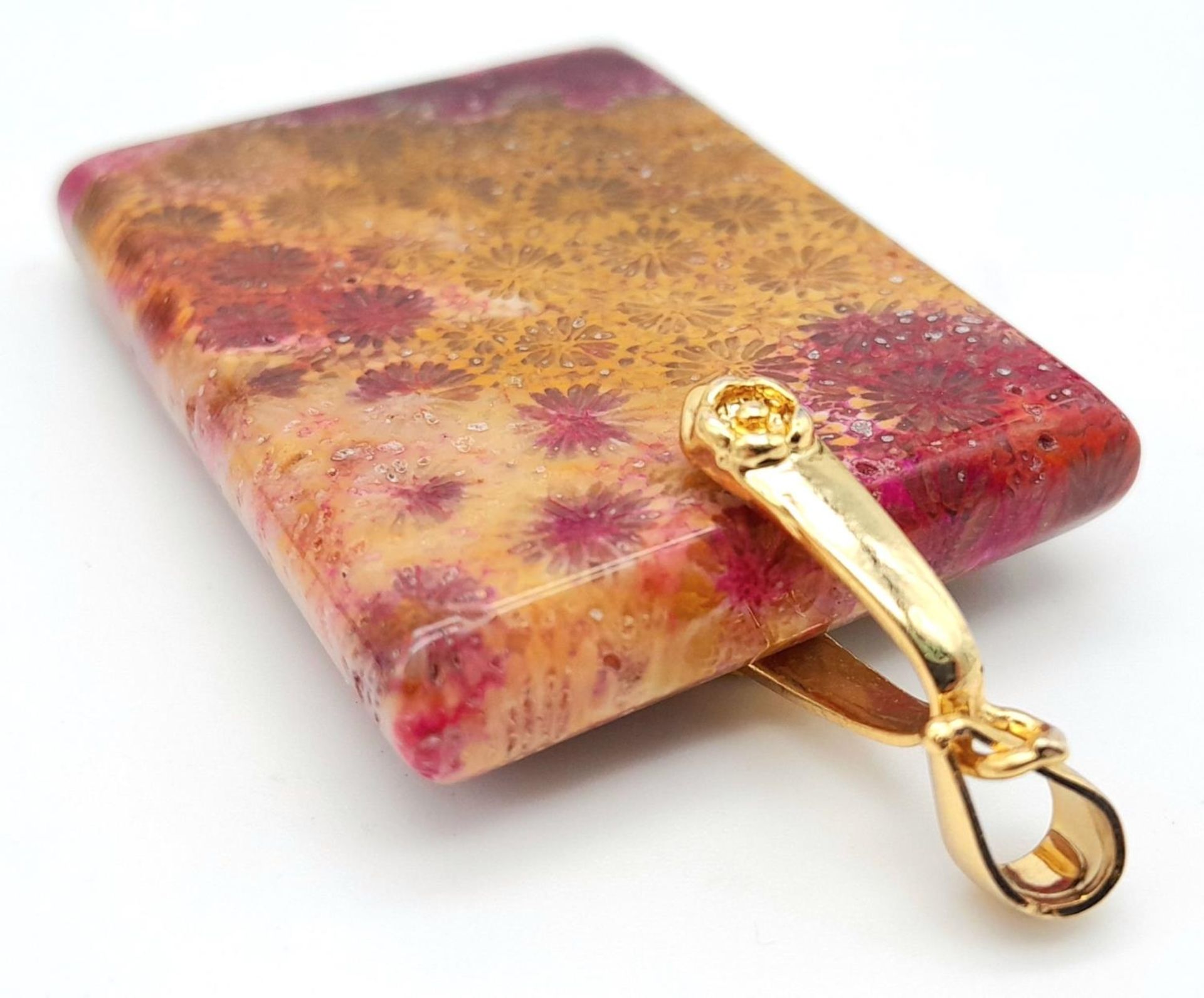 A Fossilized Sea Sediment Pendant with Gilded Bail. 6.4cm length, 27.15g total weight. - Image 3 of 4