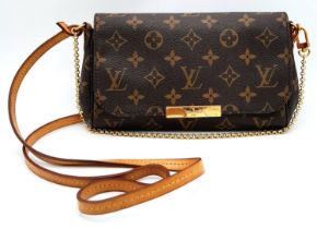 A Louis Vuitton Favourite PM Bag. Monogramed canvas exterior with gold-toned hardware, thin