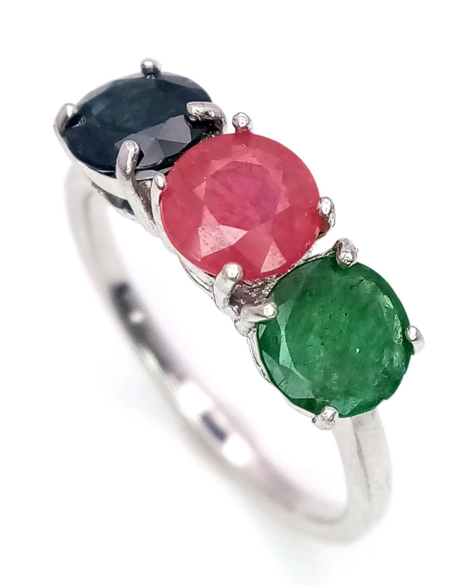 An Emerald, Sapphire and Ruby Three Stone Ring on 925 Silver. Size N1/2, 2.4g total weight. - Image 2 of 5