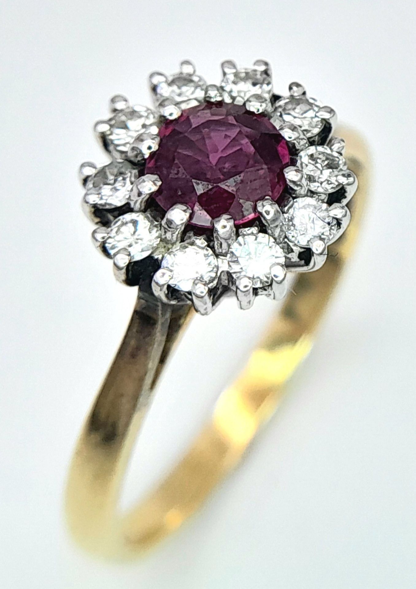 An 18K Yellow Gold, Ruby and Diamond Ring. Round cut ruby with a diamond halo. Size M 1/2. 2.8g - Image 5 of 8