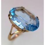 A 9ct Yellow Gold Blue Topaz Ring, 12mmx18mm topaz, size M, 4.1g total weight. ref: 1500I