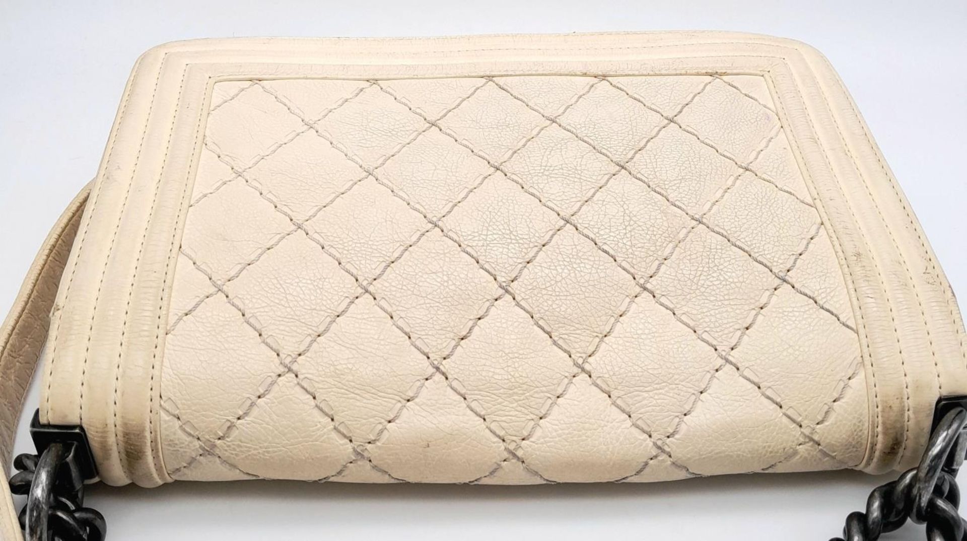 A Chanel Ivory Boy Bag. Leather exterior with chrome-toned hardware, chain and leather strap, and - Image 3 of 15