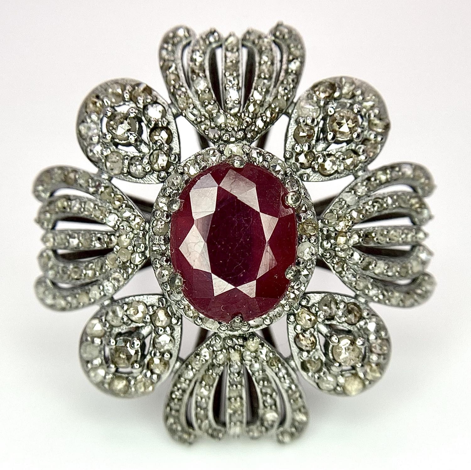 A 5ct Ruby Gemstone Cocktail Ring with 2ctw of Old Cut Diamond Decoration. Set in 925 Silver. Size - Image 4 of 6