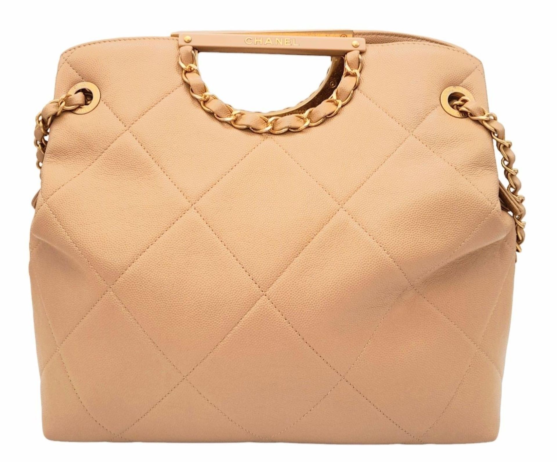 A Chanel Two-Way Chain Shoulder Bag. Beige caviar leather. Gold tone hardware. Spacious interior - Image 2 of 9