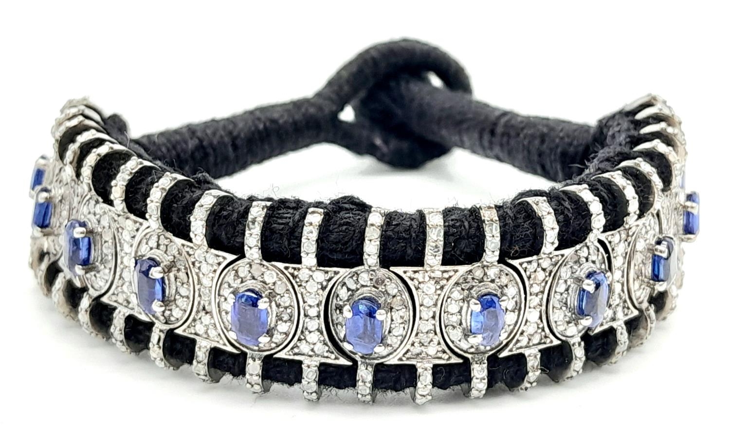 A Hand-Crafted Blue Sapphire and Diamond Encrusted Bracelet. Black textile set. Sapphires - 5ctw. - Image 5 of 8