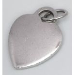 A TIFFANY & CO STERLING SILVER HEART PENDANT 7.1G , 30mm x 19mm. SC 9084