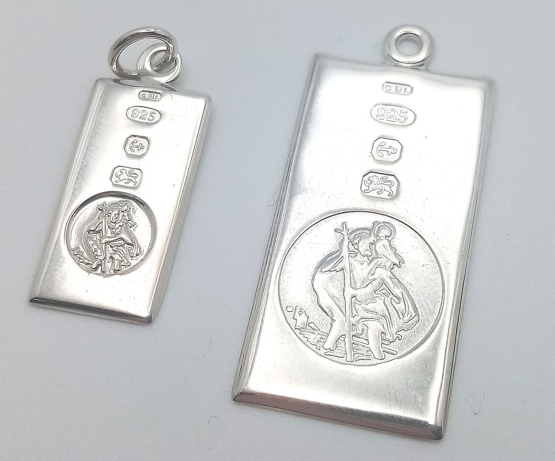 2 X STERLING SILVER RECTANGULAR ST CHRISTOPHERS. 2.8cm and 3.4cm length. 6.1g total weight. Ref: