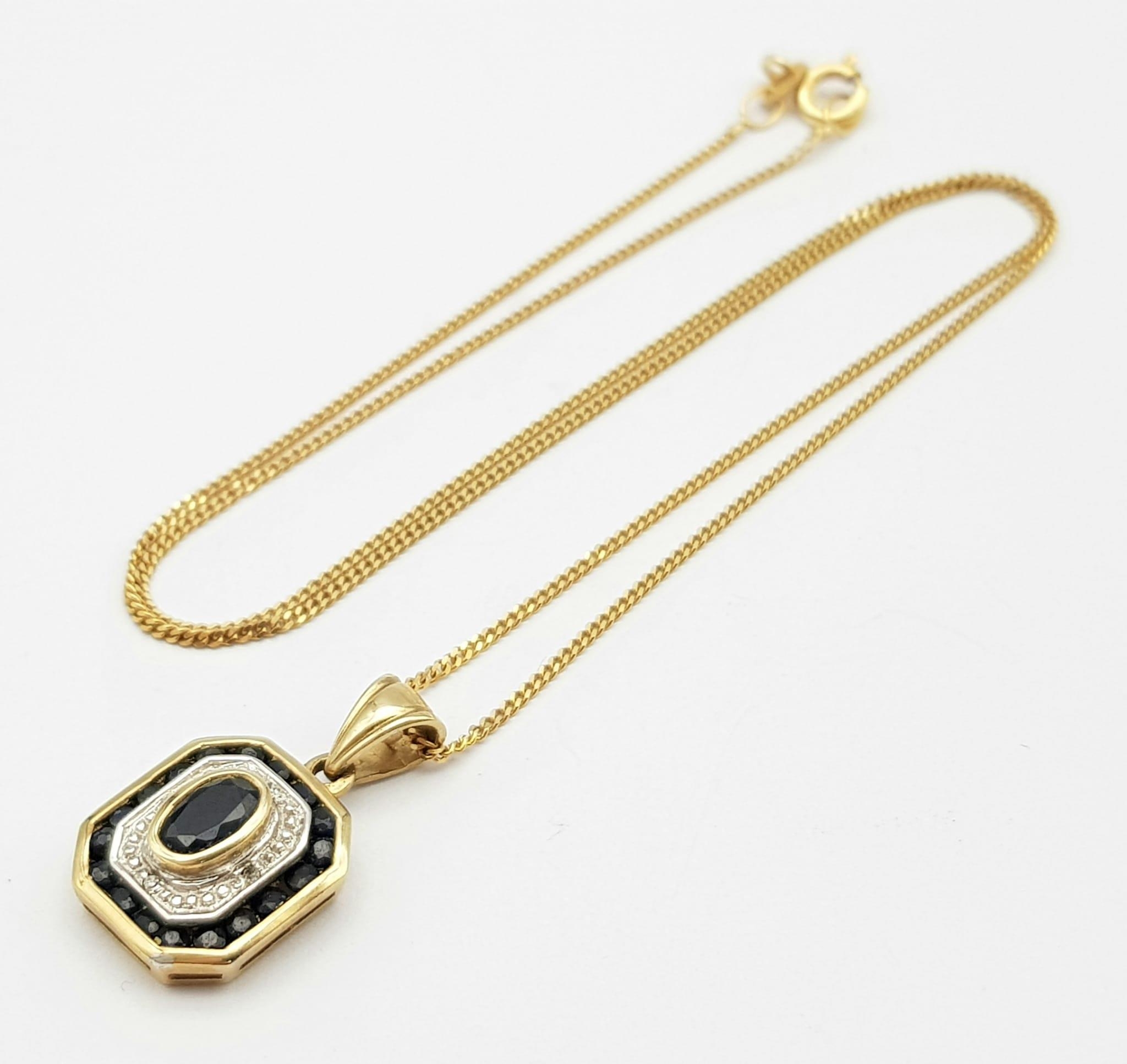 A 9K Yellow Gold Sapphire and Diamond Pendant on a 9K Yellow Gold Disappearing Necklace. Pendant -