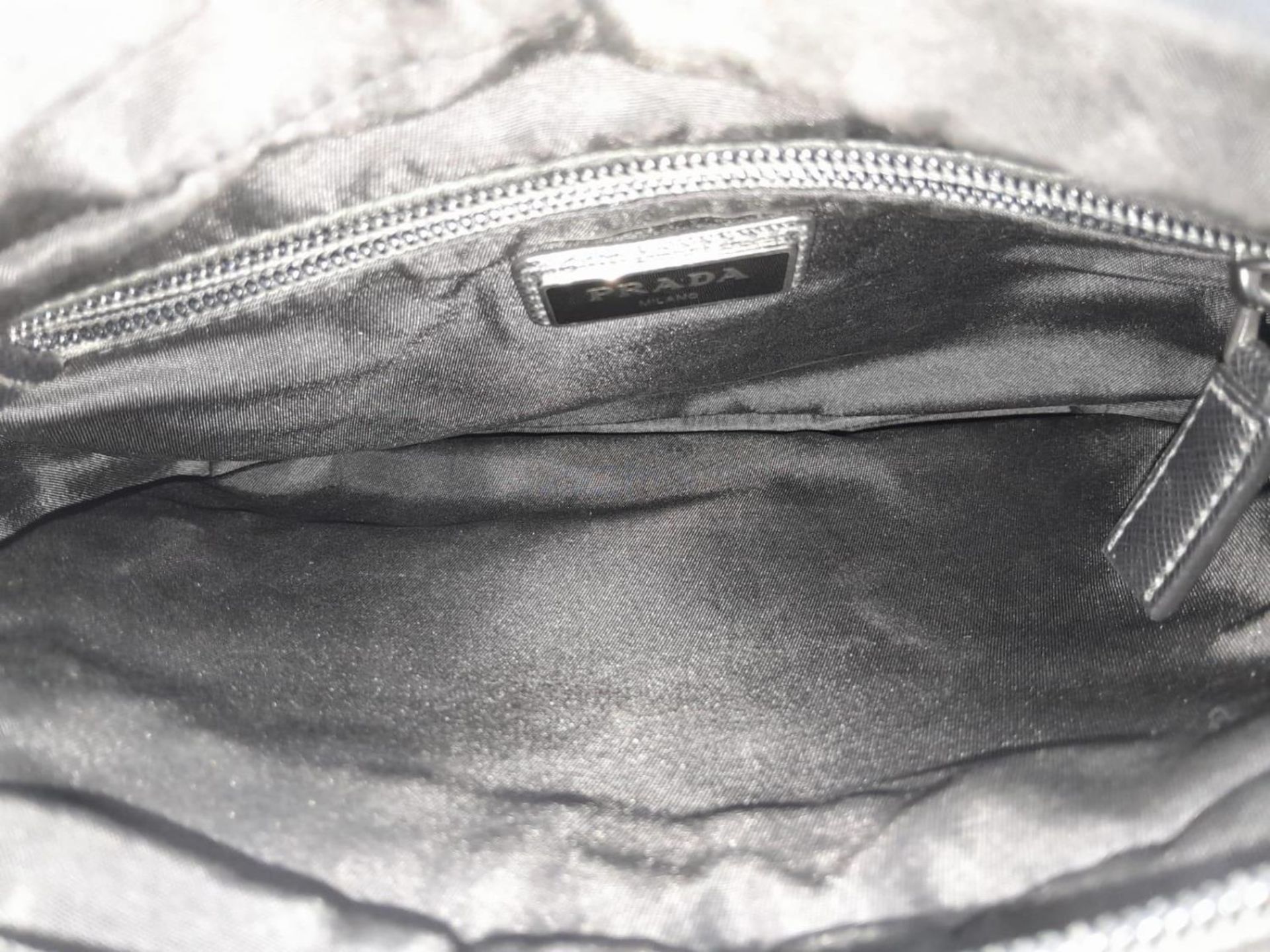 A Prada Black 'Tessuto Montagna' Crossbody Bag. Textile exterior with silver-toned hardware, a - Image 7 of 9