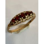 Vintage 9 carat GOLD and GARNET RING. Consisting 5 x Garnets Round cut and set to top in old-
