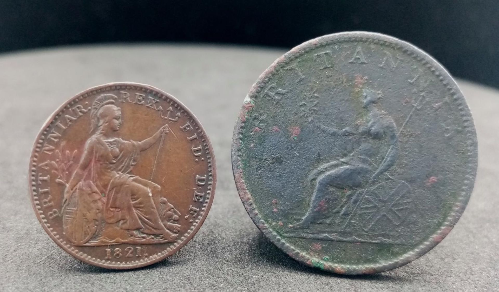 An 1821 George III Farthing and an 1806 Half Penny.