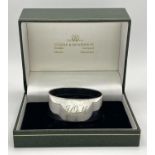 A Sterling Silver Engraved Oval Napkin Ring from Boodles and Dunthorne, in original box, Christening