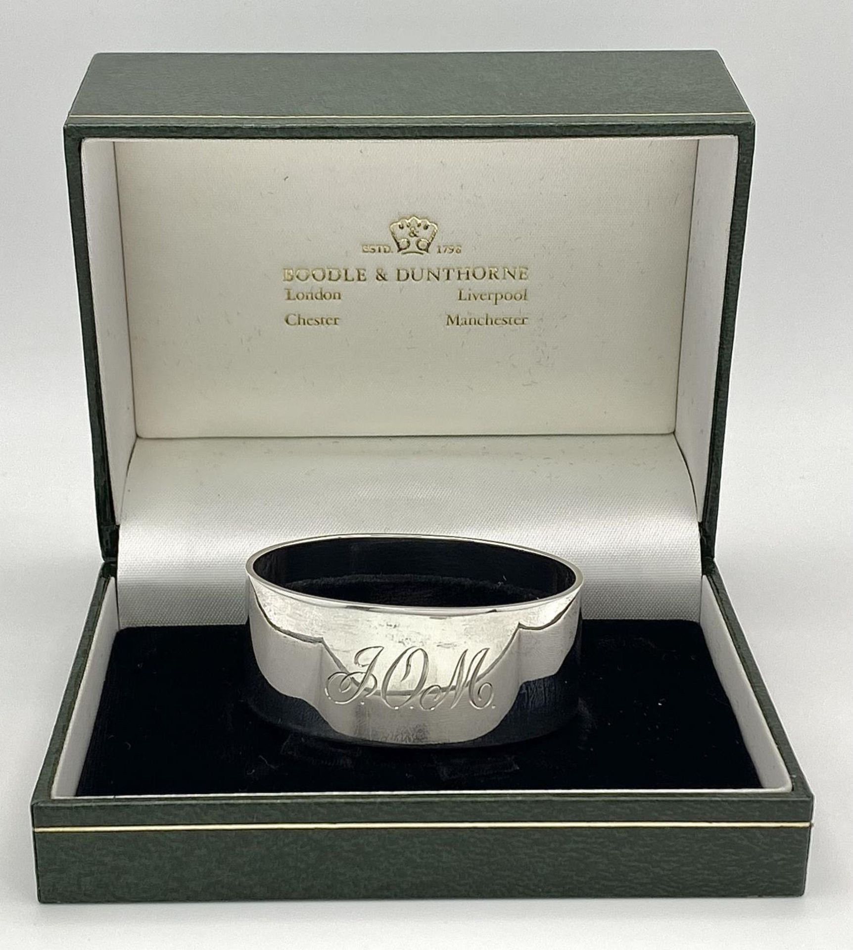 A Sterling Silver Engraved Oval Napkin Ring from Boodles and Dunthorne, in original box, Christening