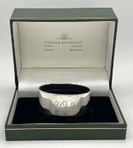 A Sterling Silver Engraved Oval Napkin Ring from Boodles and Dunthorne, in original box, Christening