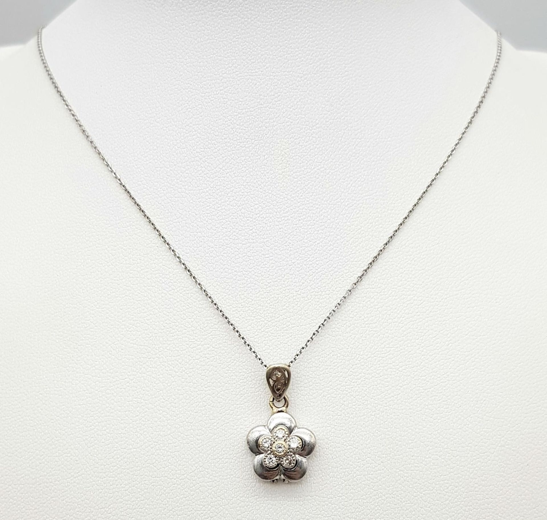 A 18ct White Gold Diamond Flower Necklace, 0.12ct diamond, 18” length, 12mm x 12mm pendant , 4.3g