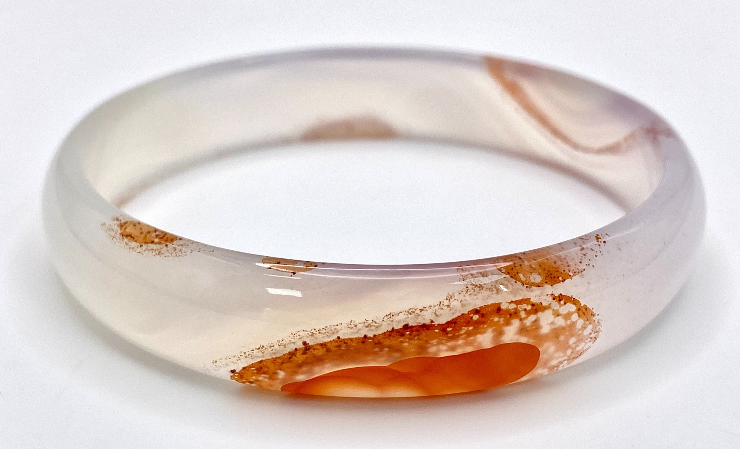 A White and Red Jade Bangle. 6cm inner diameter. - Image 2 of 3