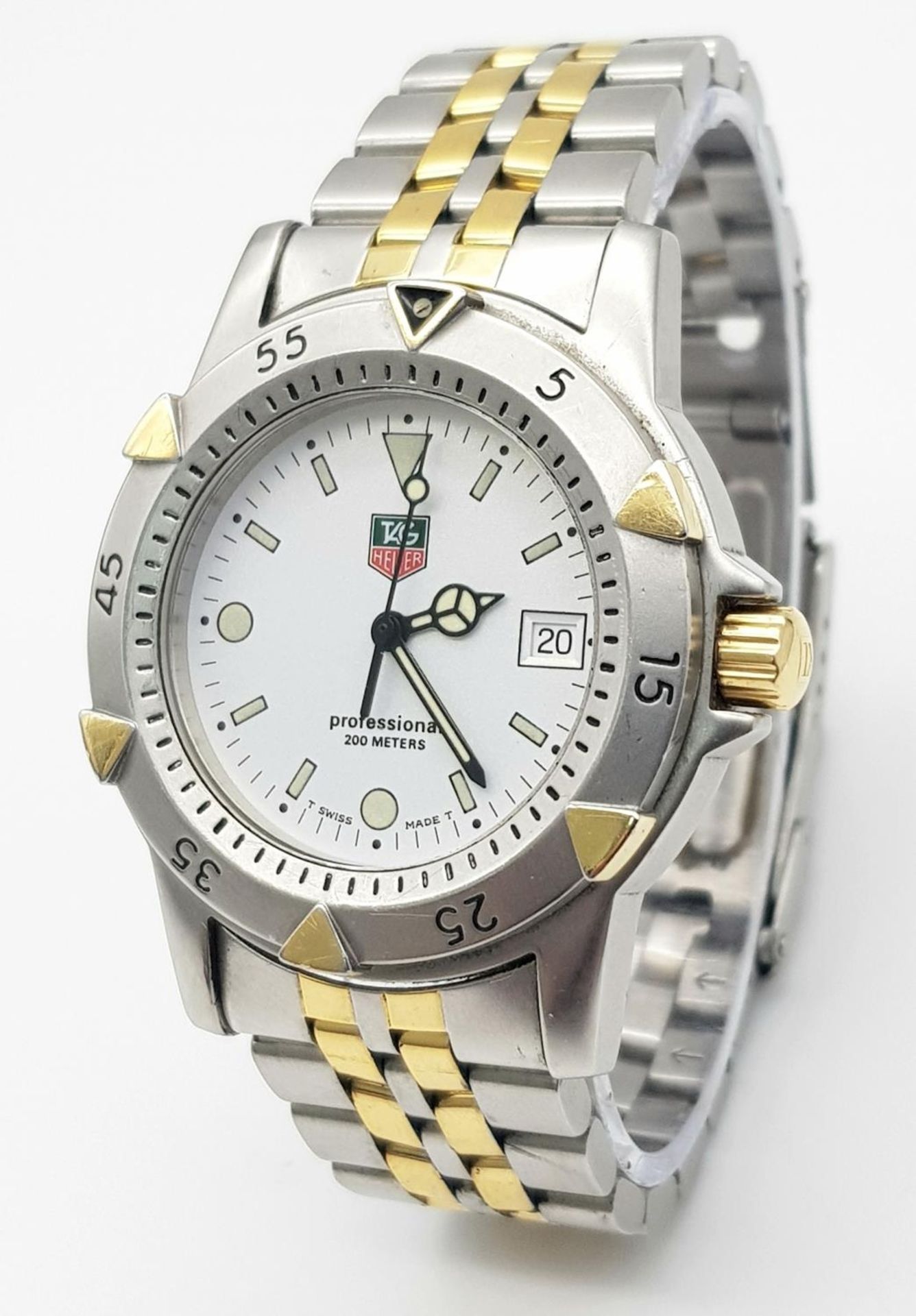 A Tag Heuer Professional Quartz Divers Watch. Two tone bracelet and case - 37mm, White dial with