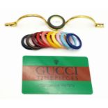 A Gucci Rainbow Bezel Multi-Change Quartz Ladies Watch. Comes with original warranty. Needs a